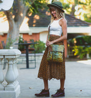 Woman wearing the Jack messenger bag by Bed Stu.
