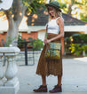 Woman wearing the Jack messenger bag by Bed Stu.