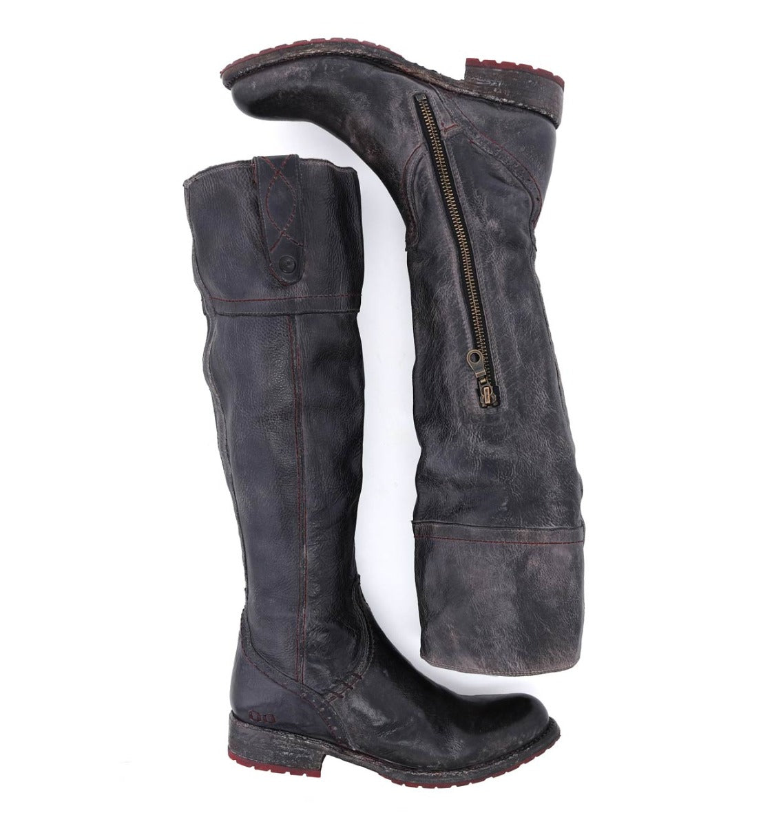 A pair of Jacqueline boots by Bed Stu with zippers on the side.