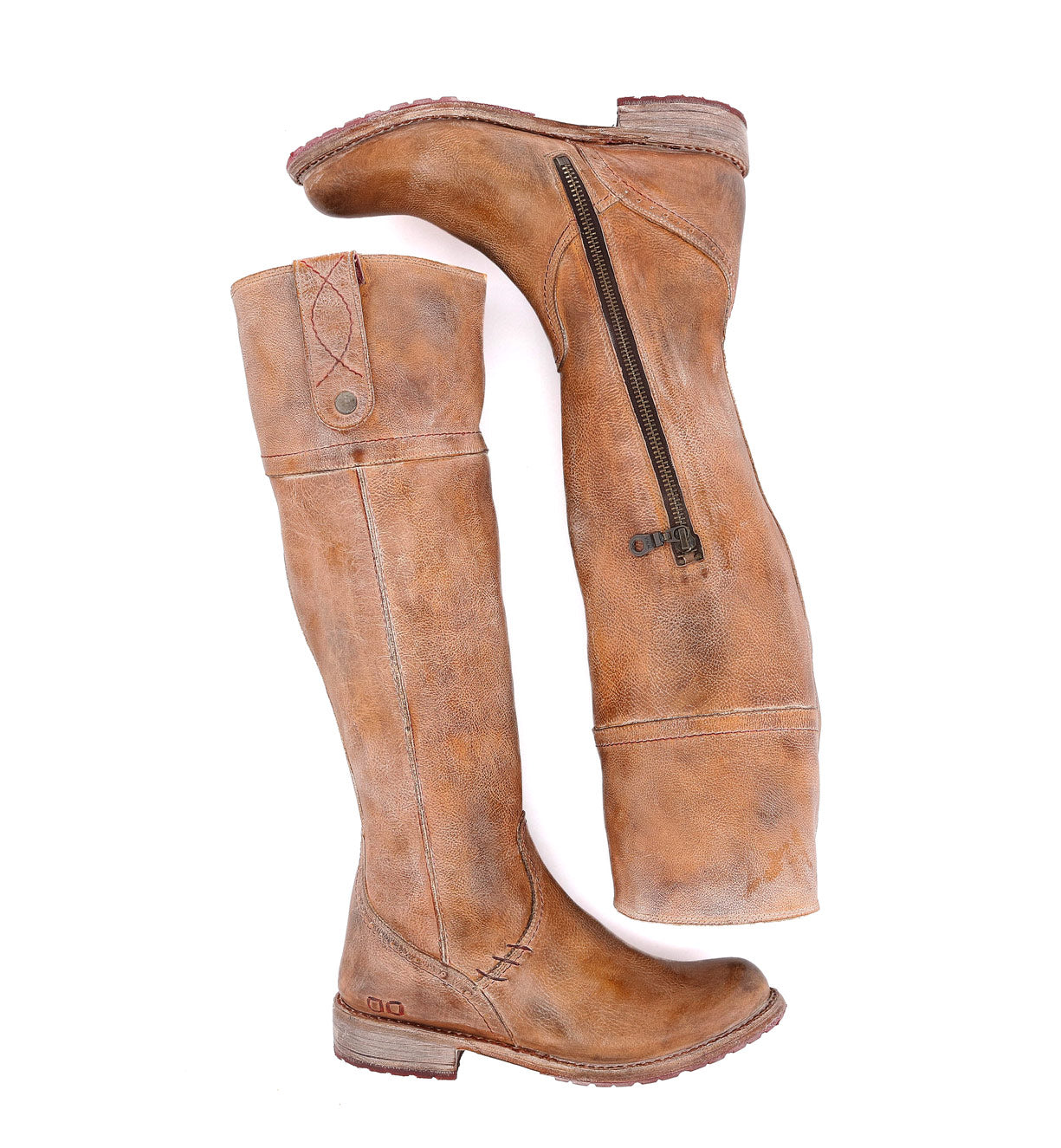 A pair of Jacqueline brown leather boots on a white background by Bed Stu.