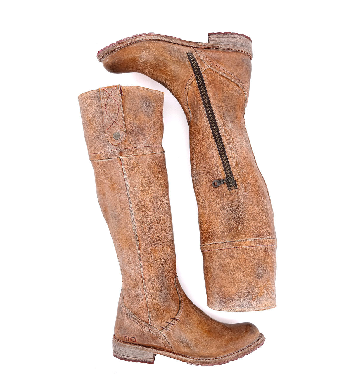 A pair of Jacqueline brown leather boots on a white background by Bed Stu.