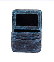 The Jeor by Bed Stu is a rustic leather card holder featuring a clear ID window at the top and two credit card slots below, with visible wear enhancing its charm.