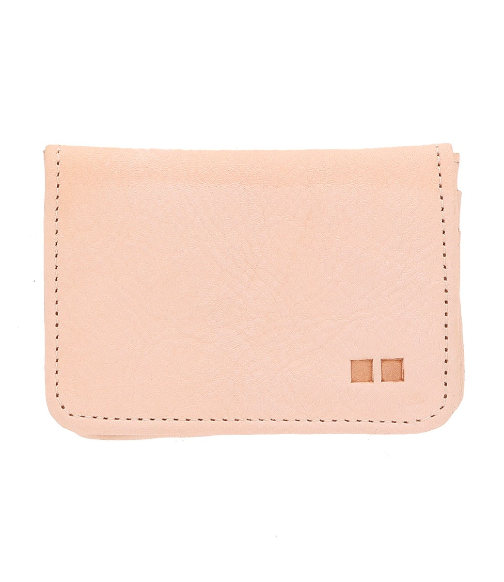 A pink Jeor leather wallet with two small squares on it, from the brand Bed Stu.