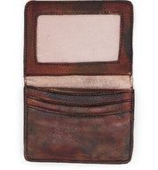 A brown leather Jeor card holder on a white background.