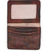 A brown leather Jeor card holder on a white background.