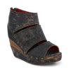 A women's black wedge sandal with a wooden heel called "Jessie" by Bed Stu.