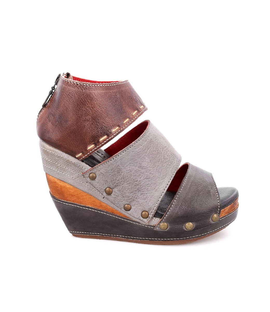 A women's grey and brown wedge sandal with straps, called Jessie by Bed Stu.