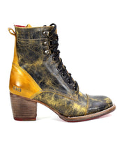 A rustic high-top Judgement boot from Bed Stu with a lace-up front, showcasing a distressed black and yellow leather finish, a tan heel counter, and a comfortable block heel.