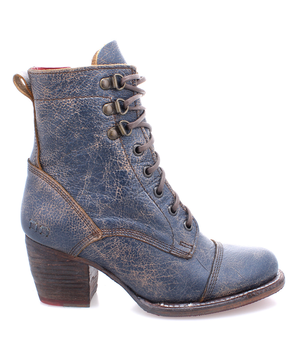 A women's blue ankle boot with a wooden heel, called Judgement by Bed Stu.