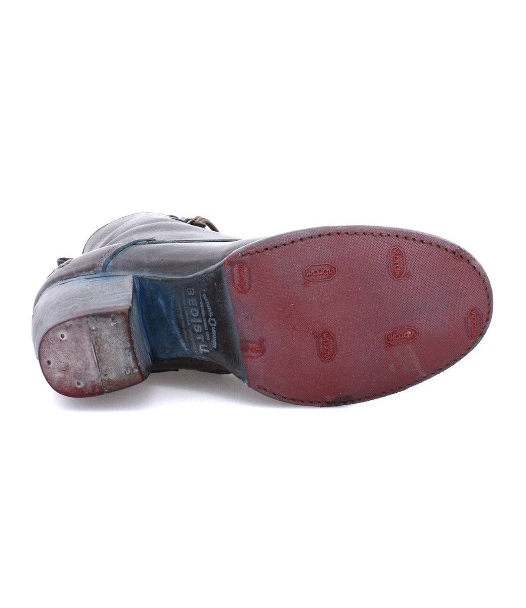 A pair of Judgement men's shoes with red and blue soles by Bed Stu.
