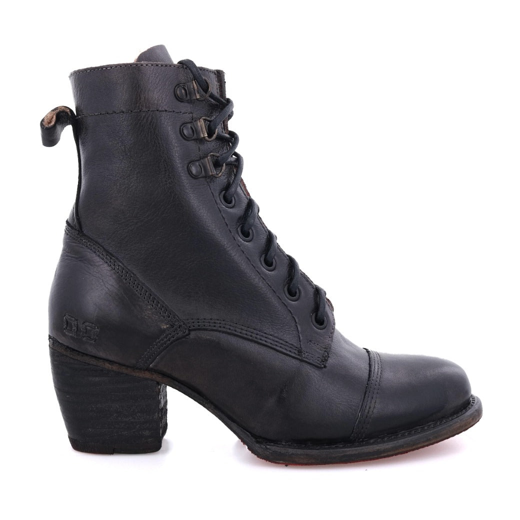 A women's black ankle boot with a wooden heel called "Judgement" by Bed Stu.