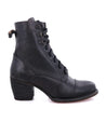 A women's black ankle boot with a wooden heel called "Judgement" by Bed Stu.