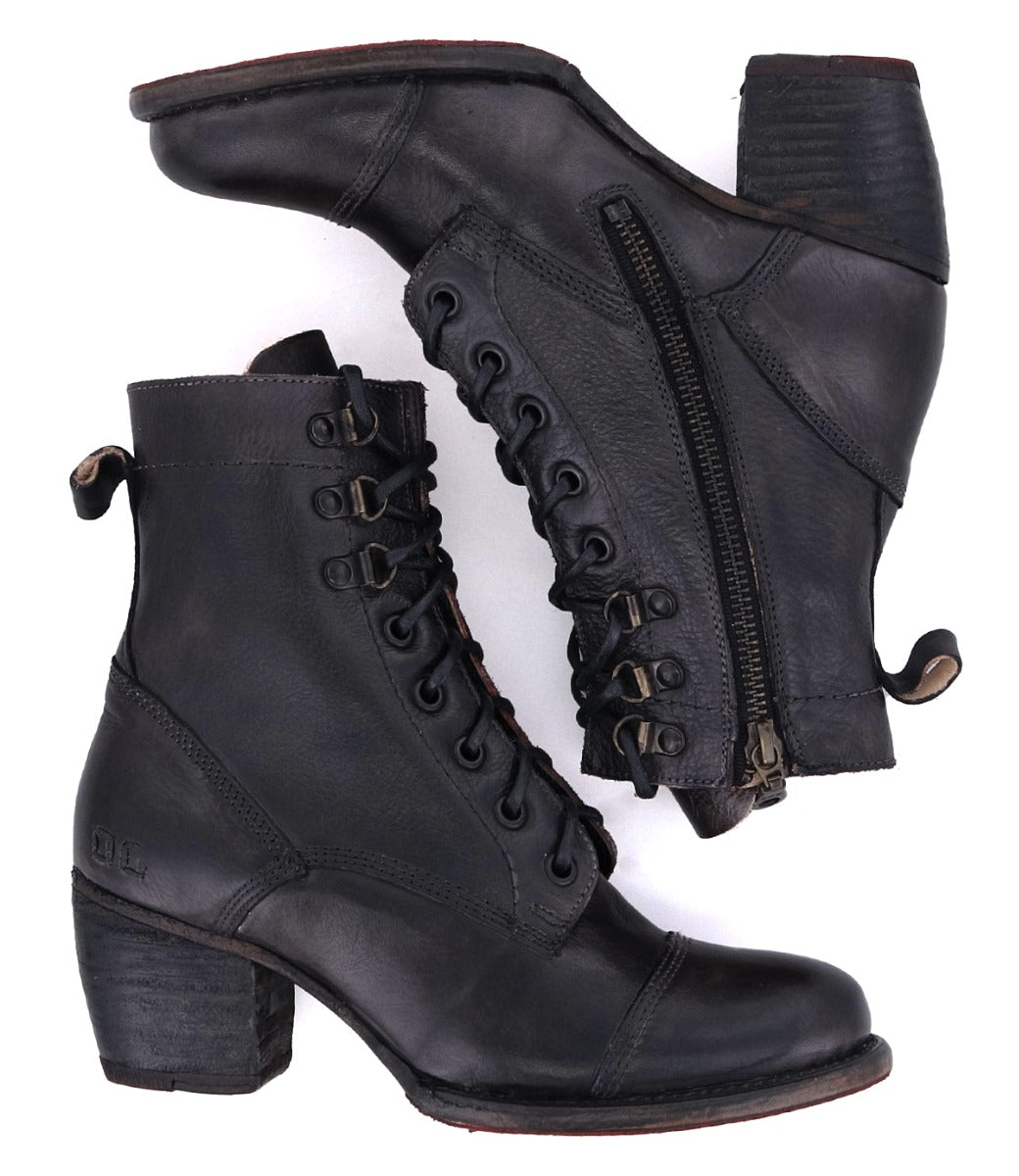 A pair of Bed Stu Judgement black leather boots with a zipper on the side.