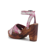Discover timeless elegance with the Kalah sandal by Bed Stu. This pink strappy high-heeled sandal features a sustainably sourced wooden platform and block heel, complemented by a chic ankle strap with sleek buckle, perfect for making a stylish statement.