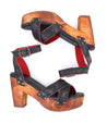 A pair of Bed Stu Kalah wooden platform sandals with red and black straps.