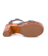 A pair of Bed Stu Kalah wooden sandals with straps and buckles.
