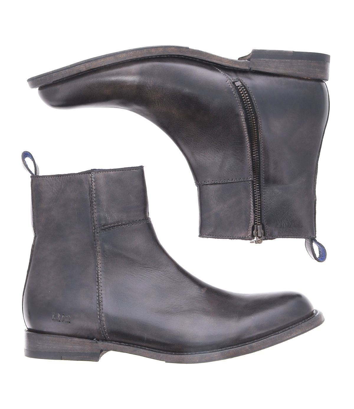 Behold the Kaldi ankle boots by Bed Stu, crafted from black leather and showcasing a classic silhouette. These stylish boots feature convenient side zippers and practical pull tabs, captured from both the side and bottom perspectives.