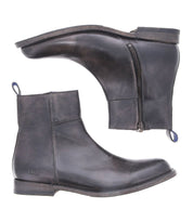 Behold the Kaldi ankle boots by Bed Stu, crafted from black leather and showcasing a classic silhouette. These stylish boots feature convenient side zippers and practical pull tabs, captured from both the side and bottom perspectives.