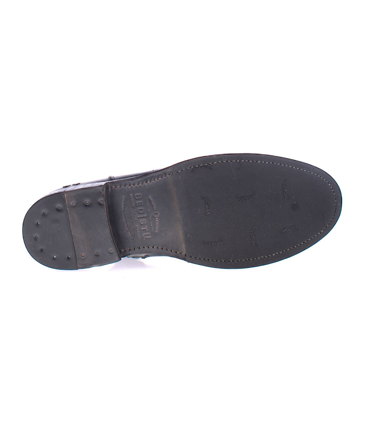 Bottom view of the Kaldi black leather ankle boot sole by Bed Stu, with visible wear marks and brand name imprint, showcasing its classic silhouette.