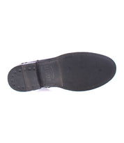 Bottom view of the Kaldi black leather ankle boot sole by Bed Stu, with visible wear marks and brand name imprint, showcasing its classic silhouette.