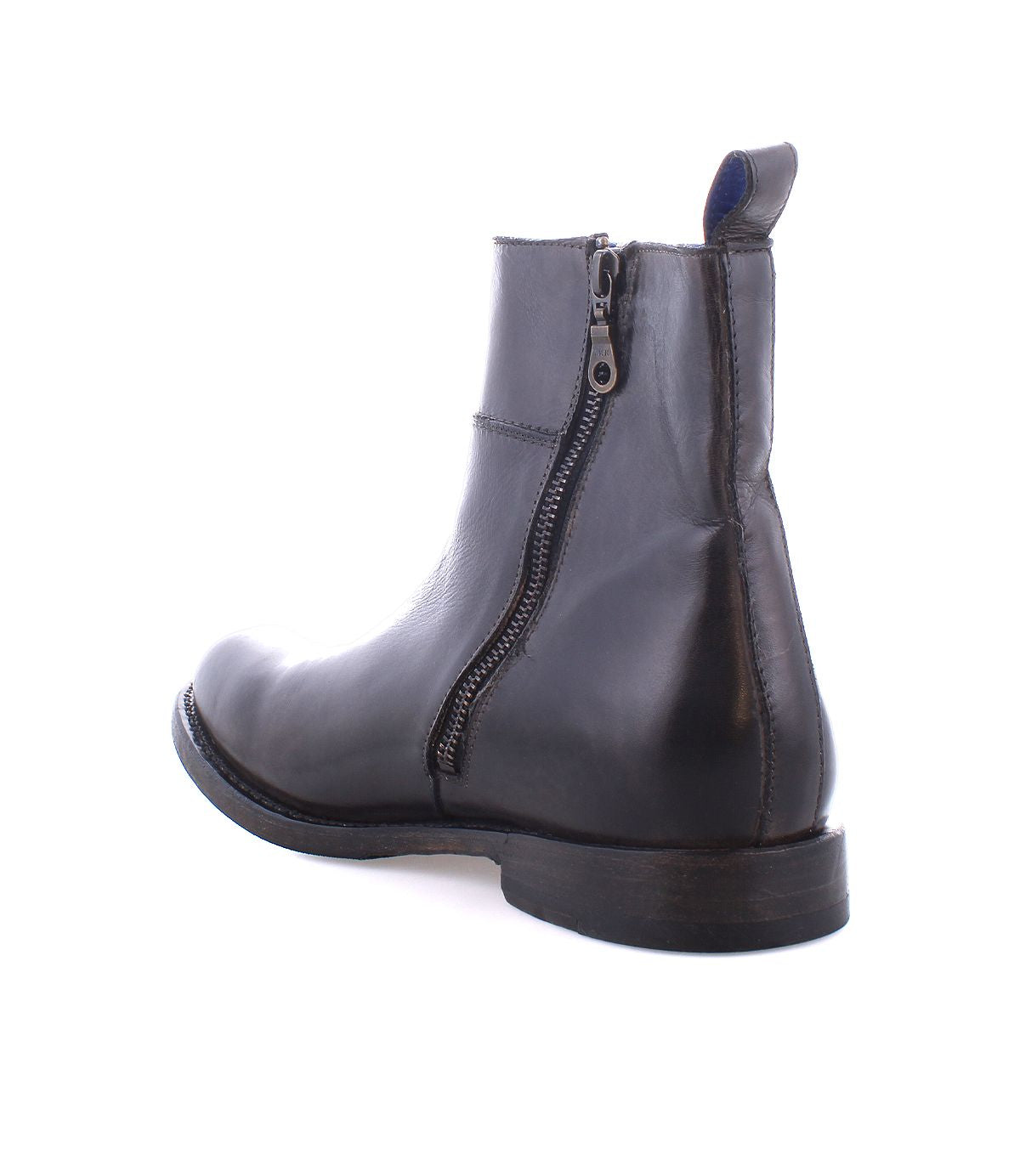 The Kaldi handmade leather boot by Bed Stu, featuring a side zipper, is shown from the back and slightly to the side, highlighting its classic silhouette.