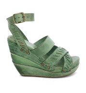 A green Kaphie wedge sandal with straps and buckles by Bed Stu.
