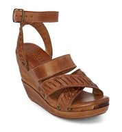 A women's tan wedge sandal with braided straps, the Kaphie from Bed Stu.