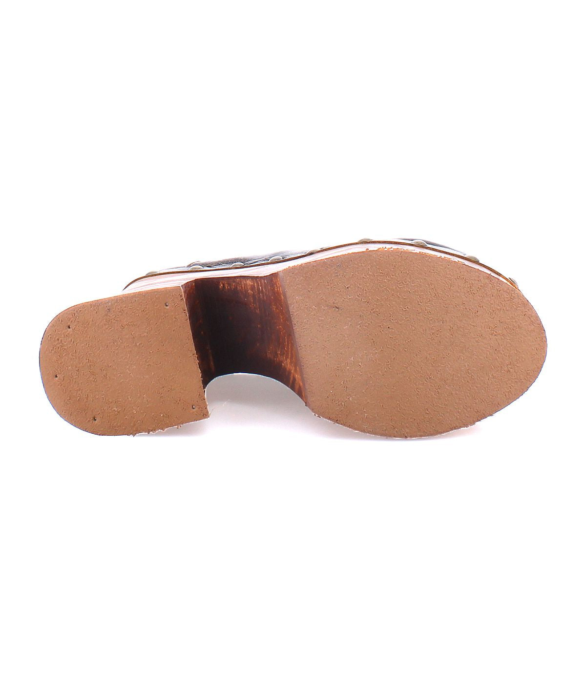 Bottom view of a well-worn Bed Stu Karaoke platform shoe displaying a partially detached sole with a noticeable gap in the middle of the heel, revealing the inner material.