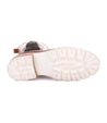 A pair of Bed Stu Kataleya women's boots with white soles and white soles.