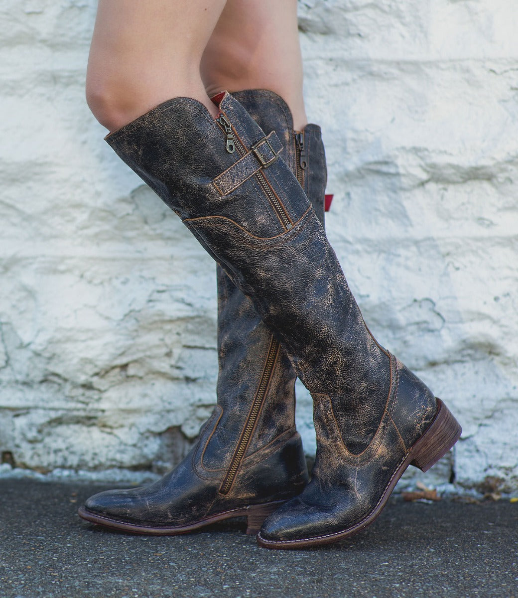 A woman in a pair of Bed Stu Kathleen black boots.