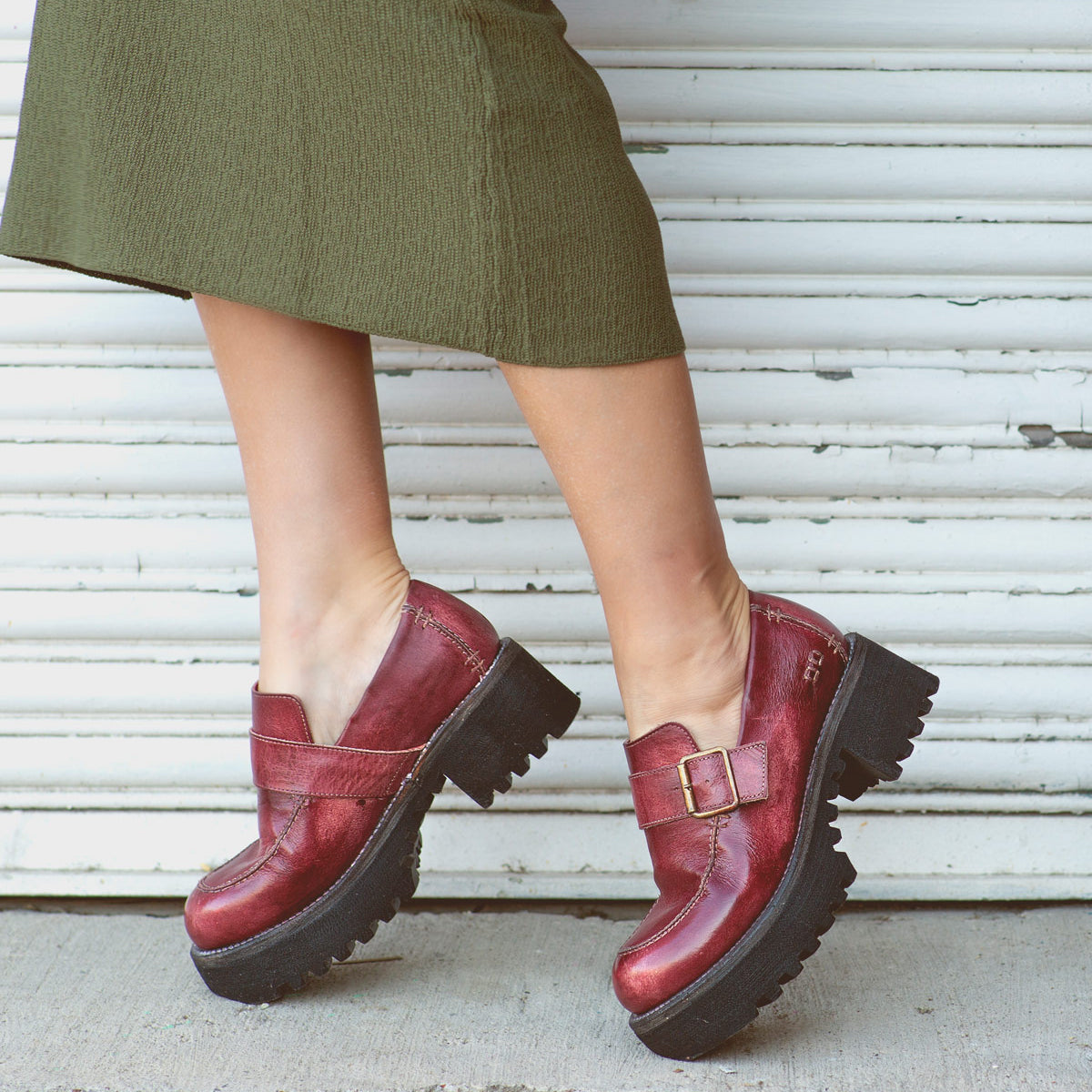 A woman wearing Bed Stu leather loafers.