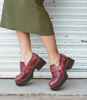 A woman wearing Bed Stu leather loafers.