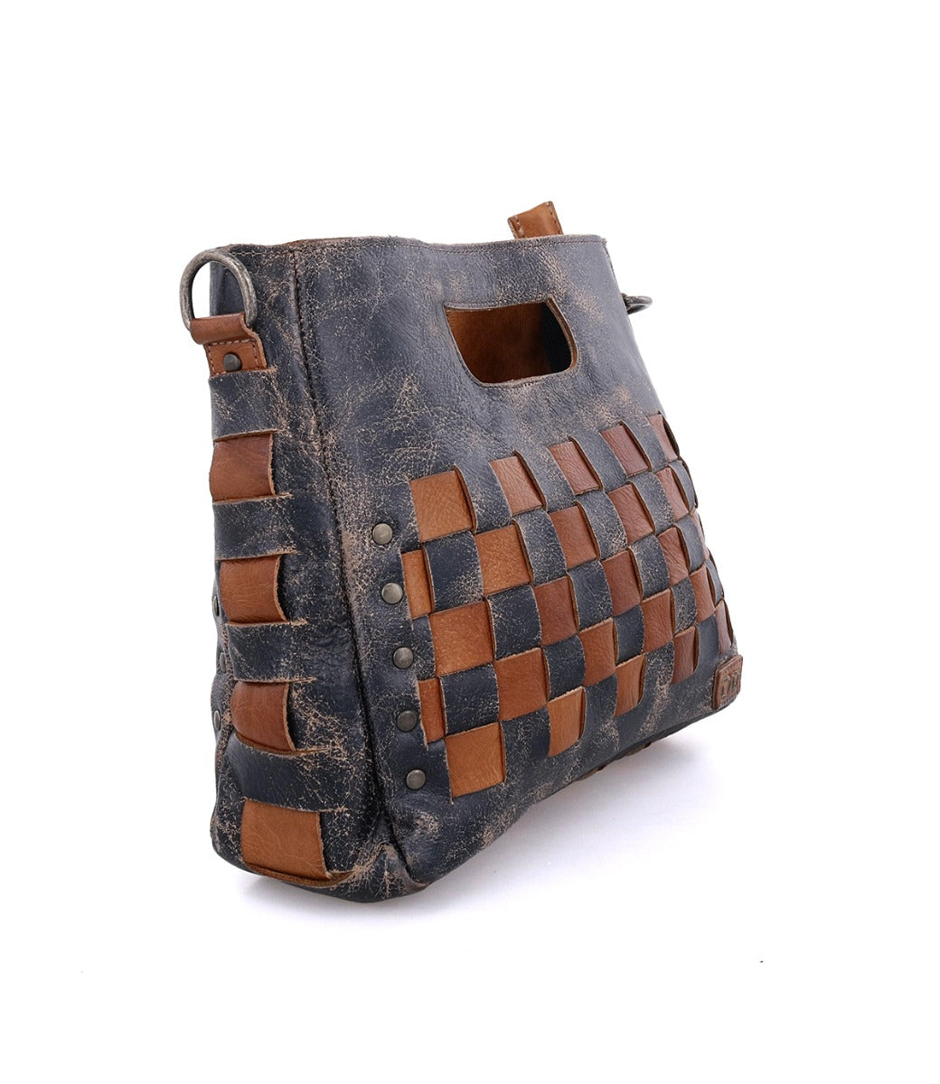 A black and brown Keiki leather bag with a woven pattern by Bed Stu.