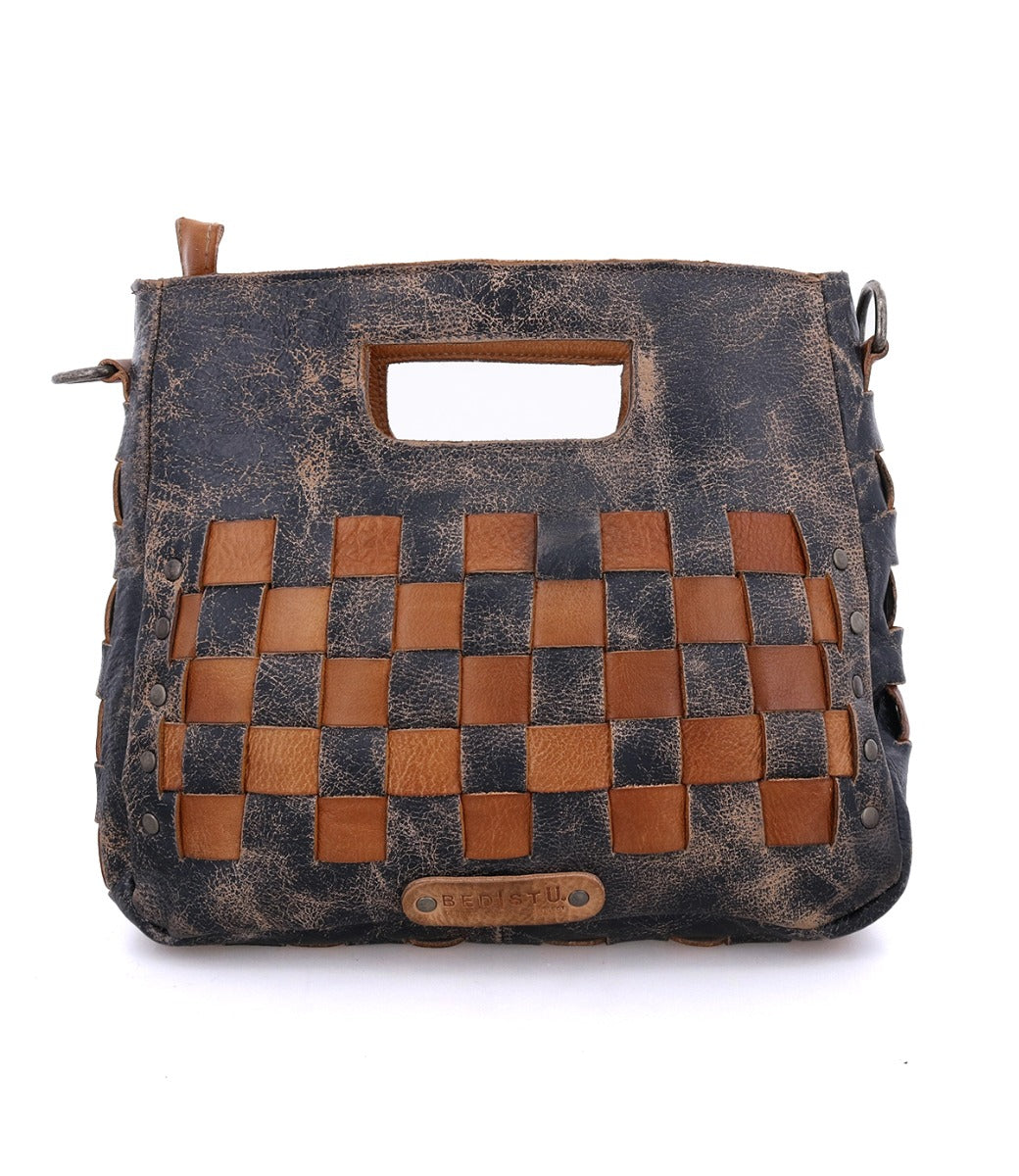 A Keiki bag by Bed Stu, made of black and tan leather with a checkered pattern.