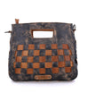 A Keiki bag by Bed Stu, made of black and tan leather with a checkered pattern.