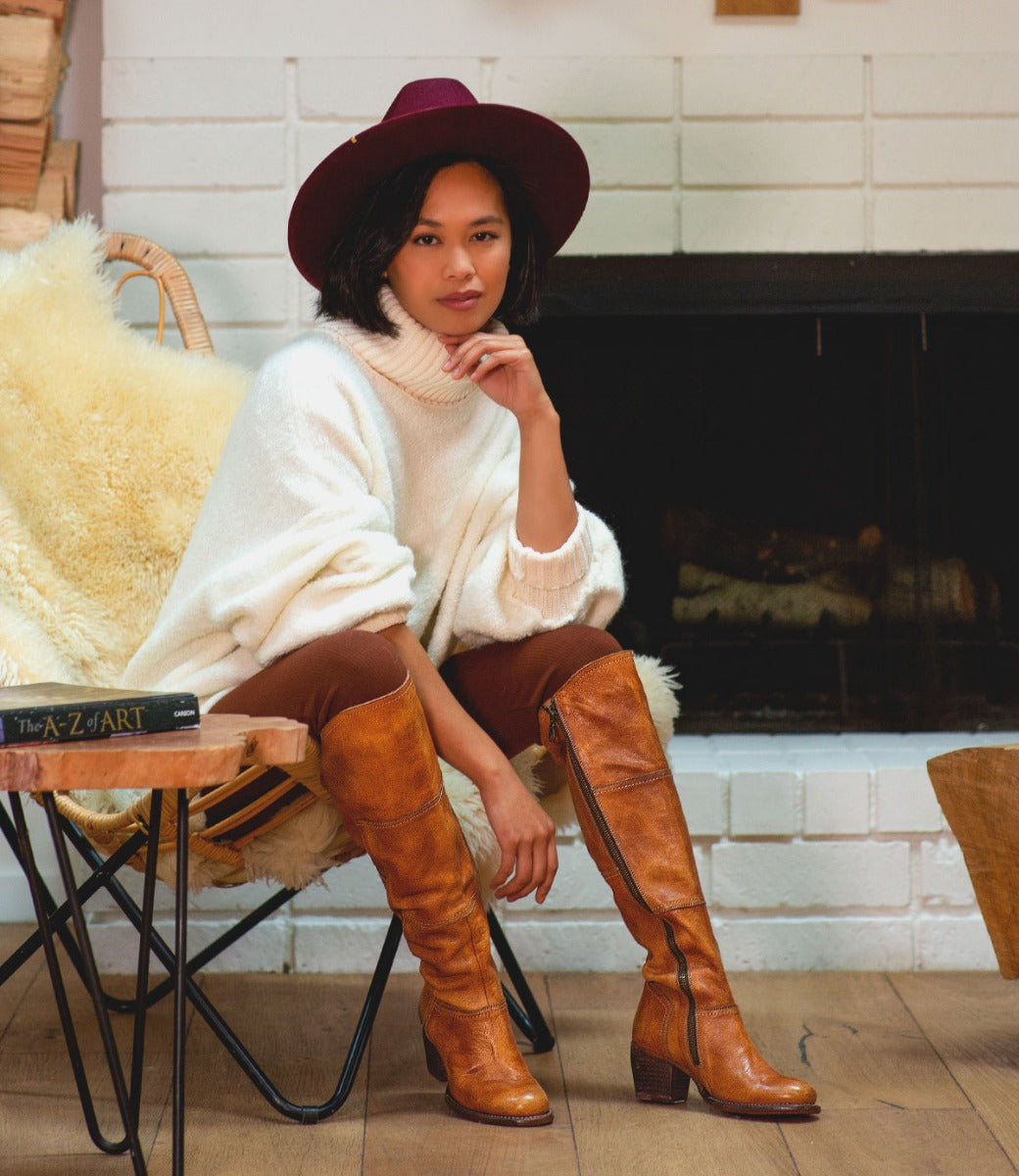 A woman in a pair of Bed Stu Kennice pecan leather boots.