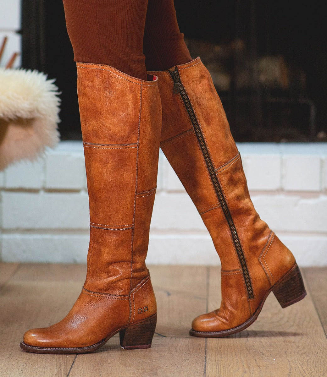 A woman in a pair of Bed Stu Kennice pecan leather boots.