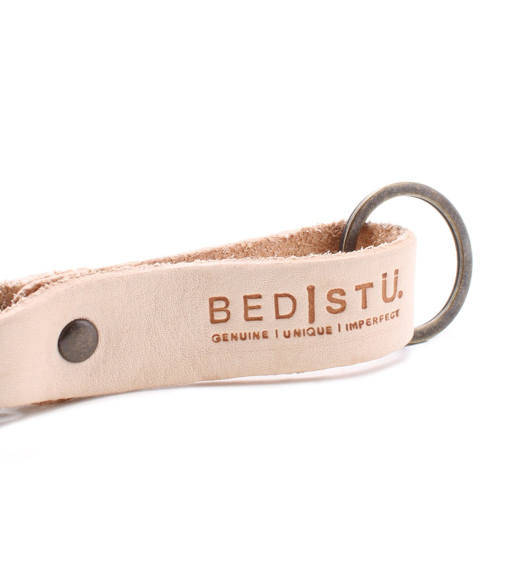 A Keygrab key ring with the word utstu on it. (Product Name: Keygrab, Brand Name: Bed Stu)
