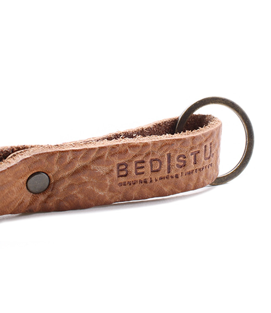 A leather Keygrab with the word Bed Stu on it.