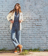 A woman wearing Khya boots by Bed Stu, made of pure leather with brown laces.