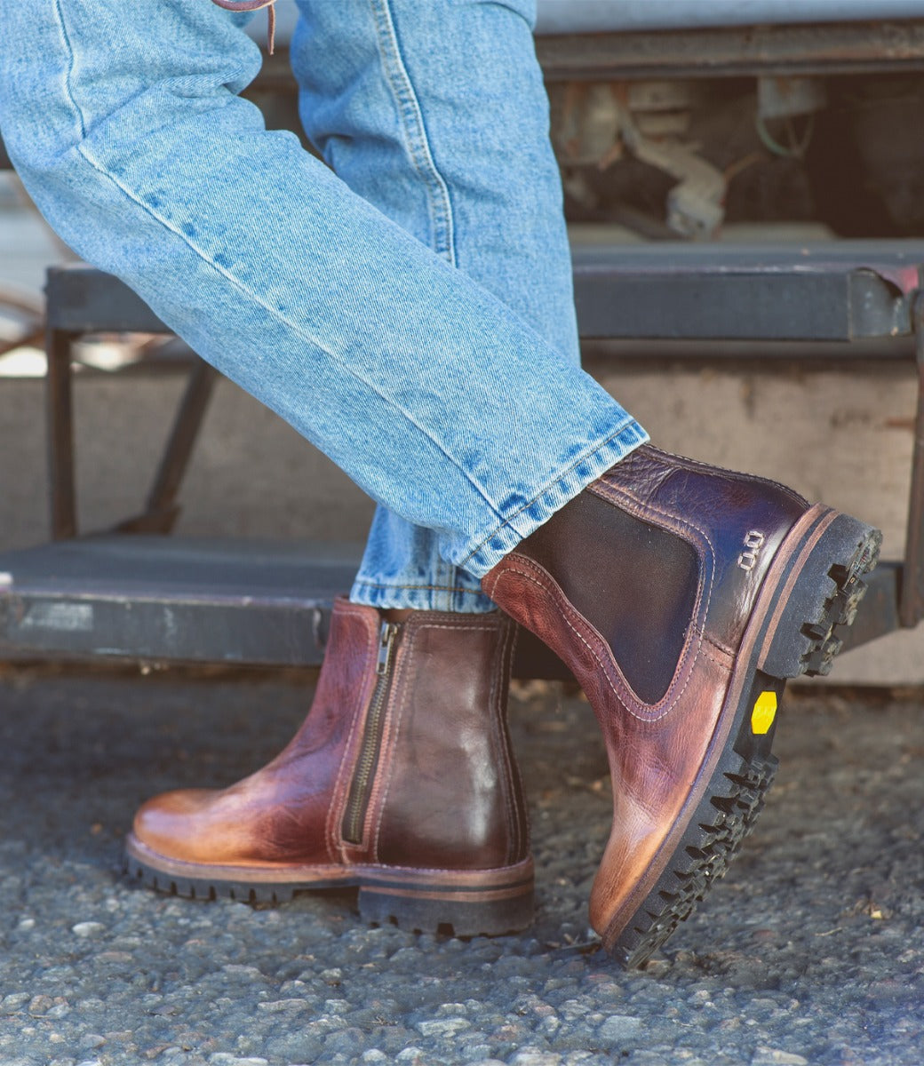 A person wearing a pair of Bed Stu Kiefra Trek brown leather chelsea boots.