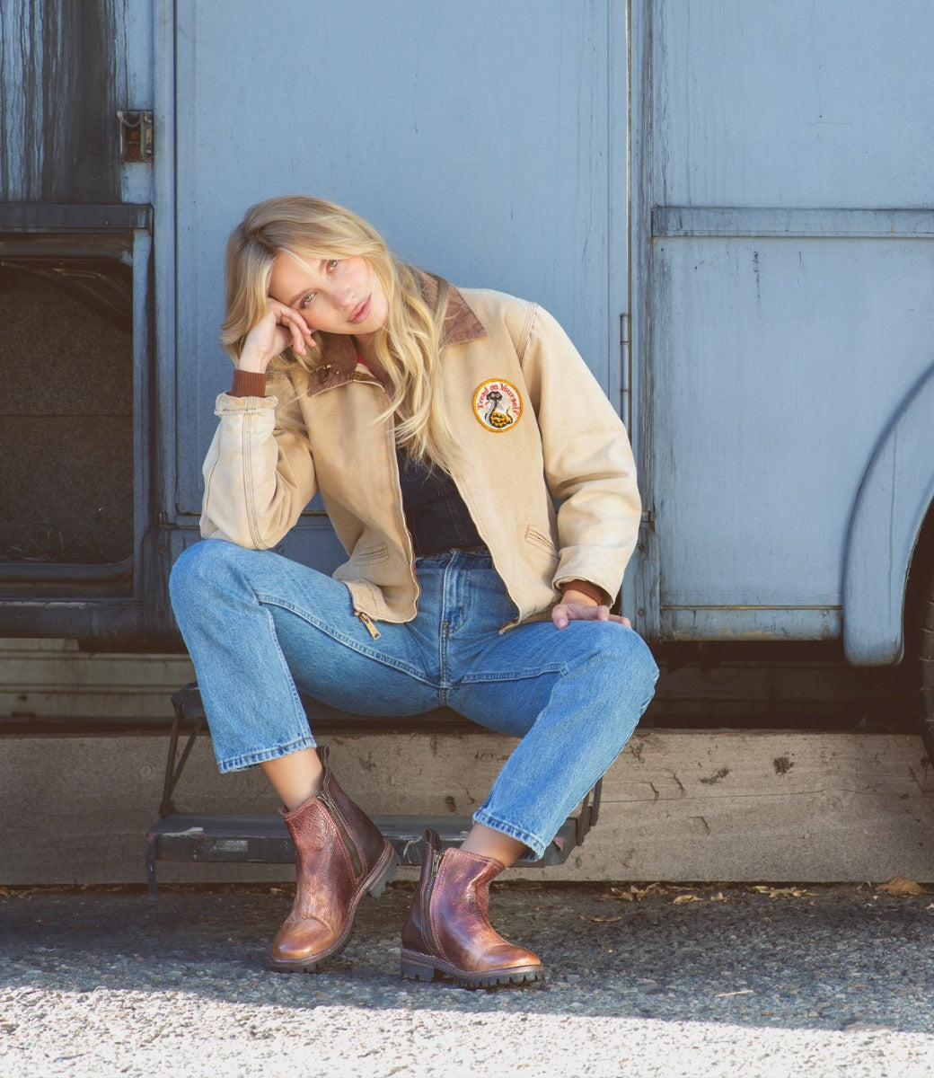 A woman in denim jeans and jacket wearing Kiefra Trek by Bed Stu.