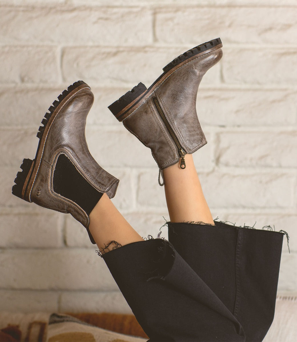 A woman's legs in a pair of Bed Stu Kiefra Trek boots.