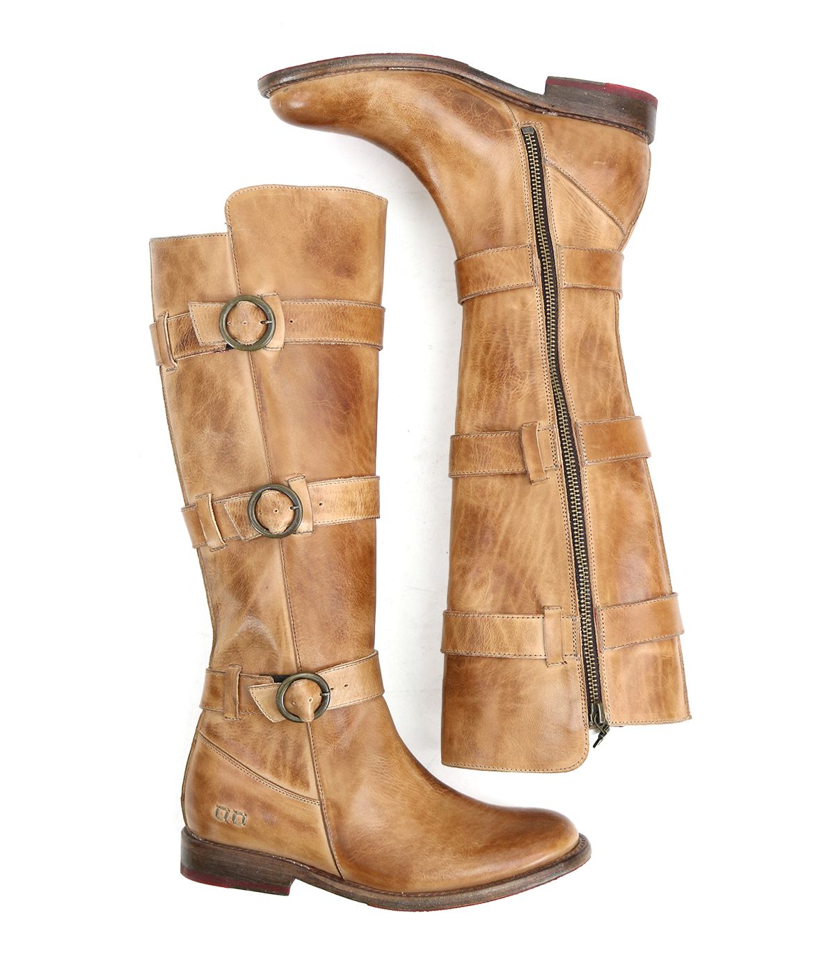 A pair of Bed Stu Kitty tan knee-high leather boots with three buckle straps and side zippers, exuding edgy sophistication and customizable fit, displayed in an upright and side position.