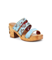 The Kreep by Bed Stu is a light blue open-toe sandal with a chunky wooden heel and 70's-inspired floral cutouts on the straps.