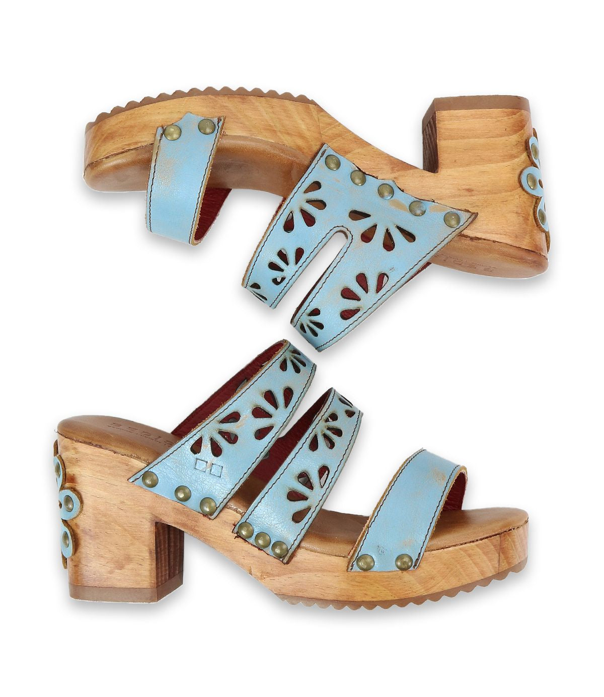 A pair of 70's-inspired "Kreep" light blue open-toed sandals by Bed Stu, featuring floral cutouts and wooden block heels, displayed side by side against a white background.