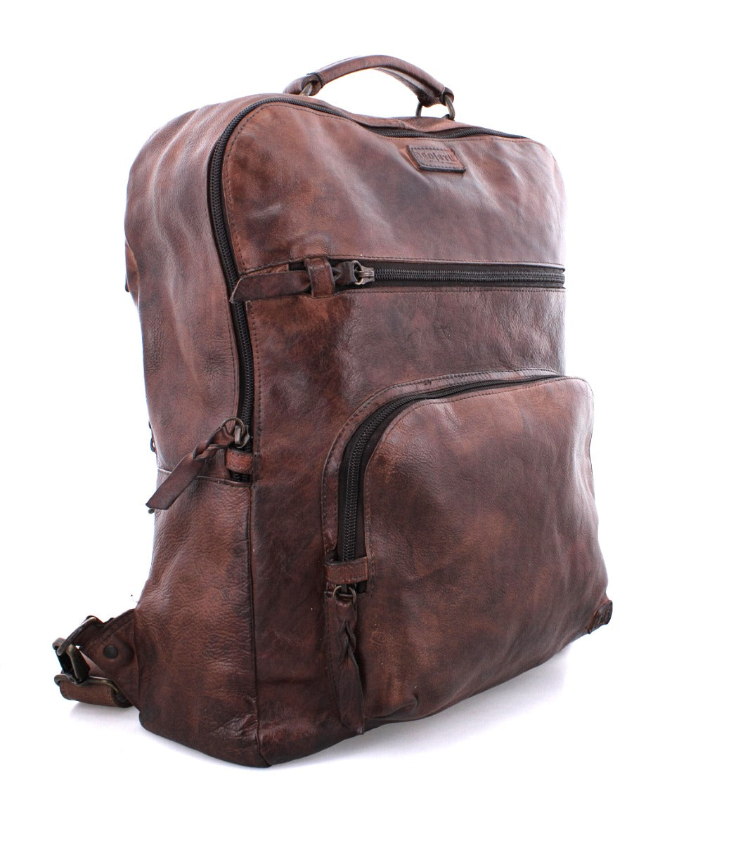 A Lafe by Bed Stu brown leather backpack on a white background.