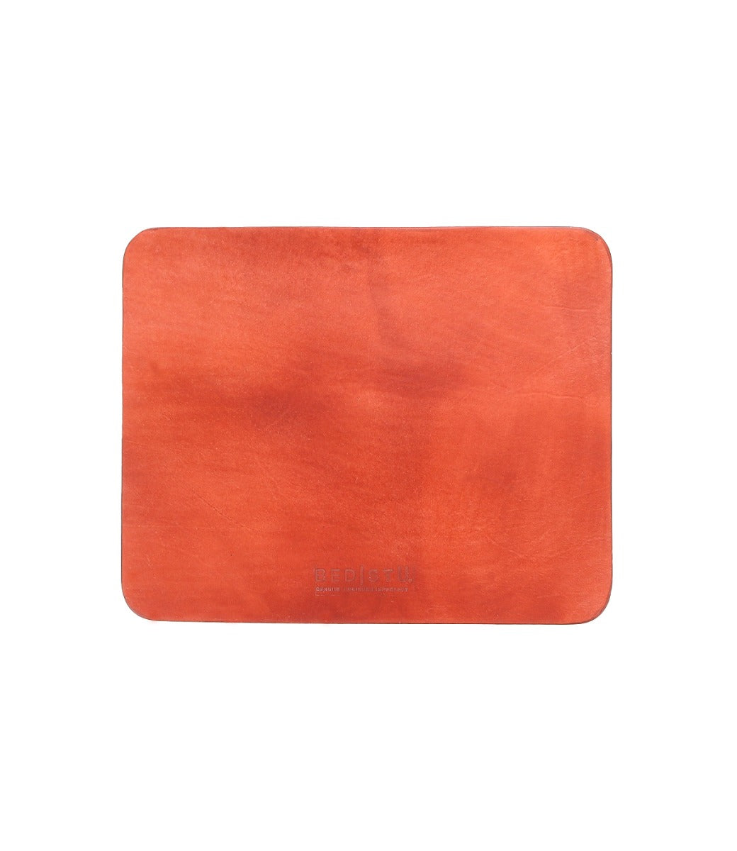 A dark green leather placemat with a smooth surface, rectangular in shape, featuring a suede underside and the brand name "Bed Stu" embossed at the bottom center. Perfect for adding elegance to your curated workspace.
