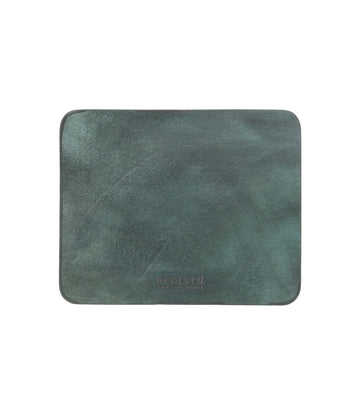 A dark green leather placemat with a smooth surface, rectangular in shape, featuring a suede underside and the brand name "Bed Stu" embossed at the bottom center. Perfect for adding elegance to your curated workspace.