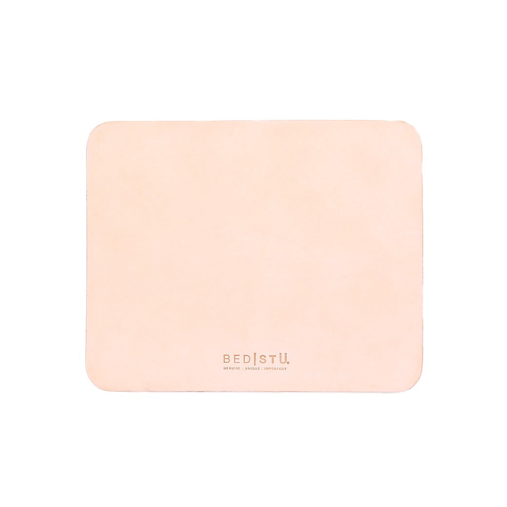 Rectangular beige leather Launcher Mouse Pad with a suede underside, rounded edges, and the brand "Bed Stu" embossed at the bottom center, perfect for a curated workspace.